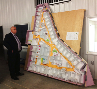 Dan Florizone at the 3P mock up in the warehouse at Moose Jaw, Saskatchewan