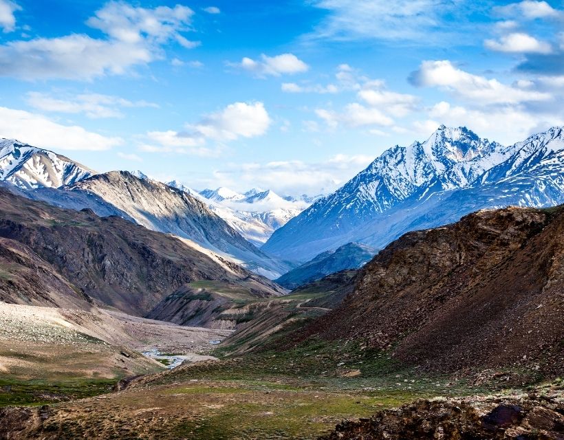 Snow-capped mountains and a valley.