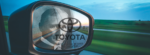 rear view mirror looking behind to Taylor and Toyota's history